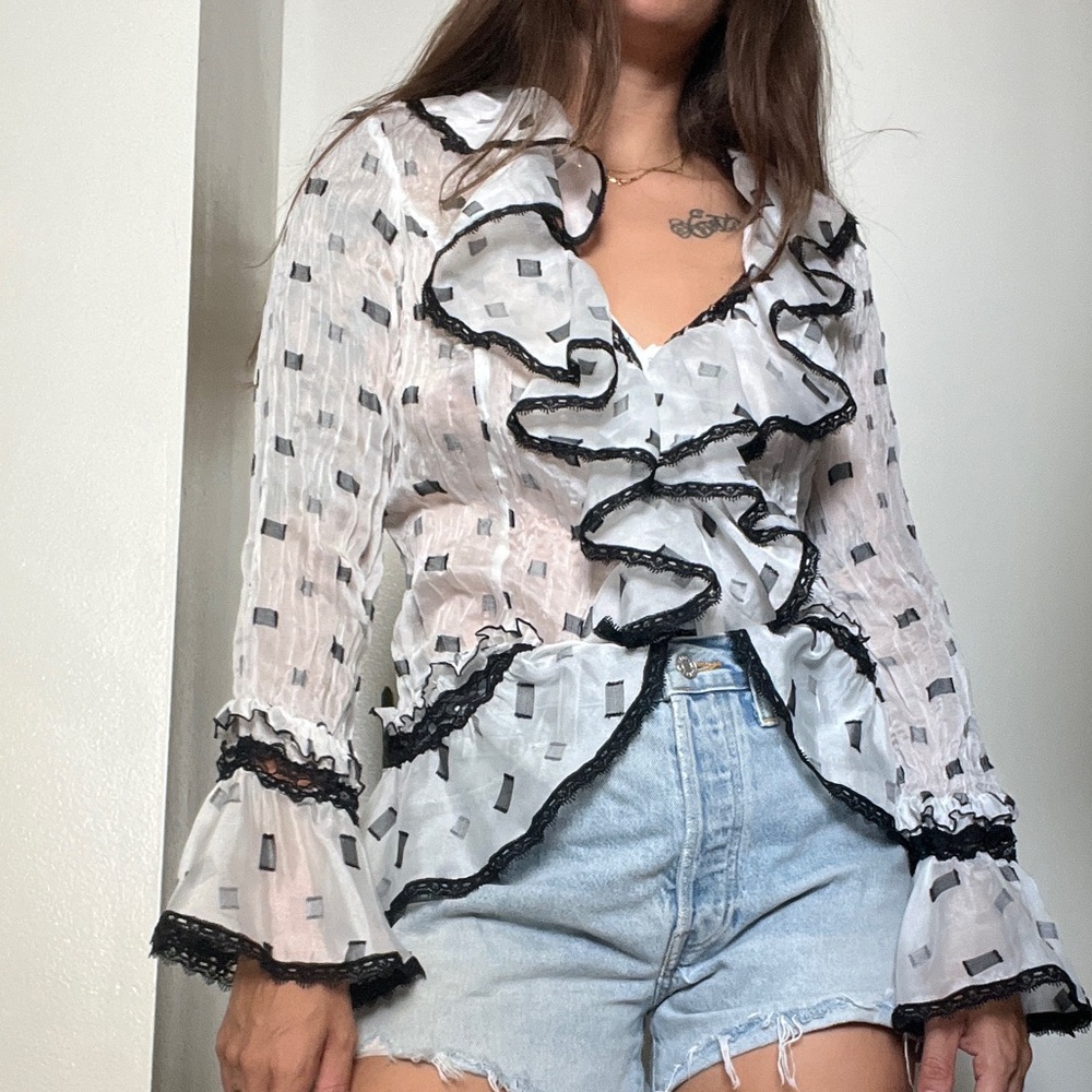 White and black ruffled blouse